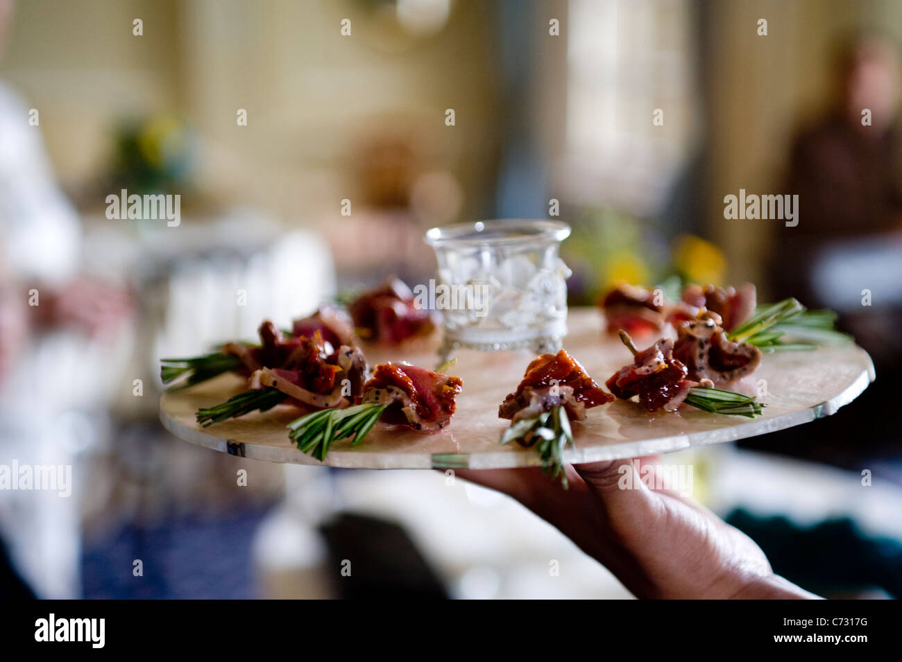 Catering at an event in London with canapees on a dish Stock Photo