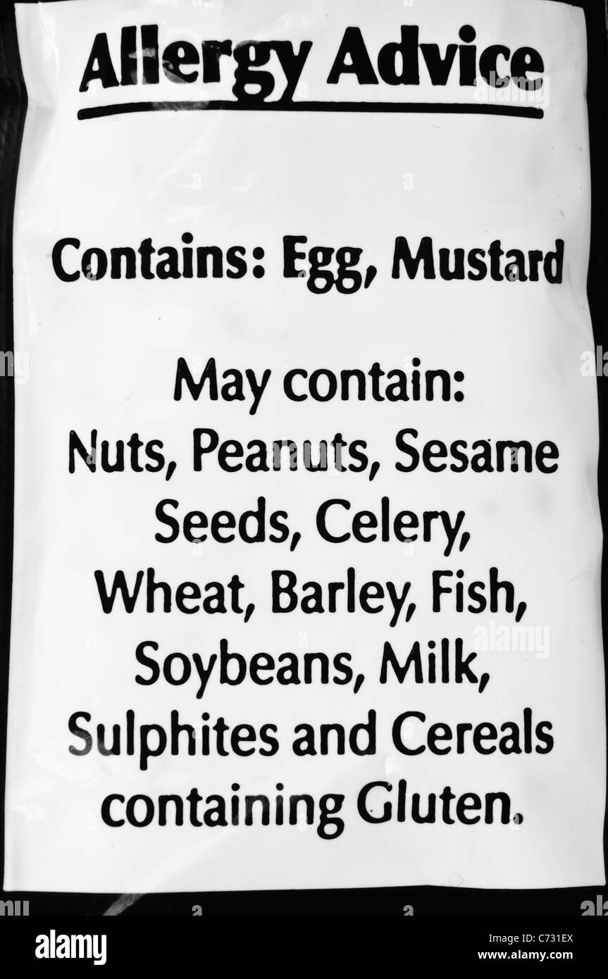 Allergy advice label warning that the product contains Egg and Mustard but may also contain a large number of allergens Stock Photo