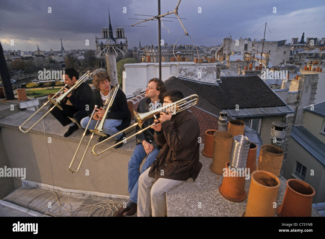 A group of musicians practicing on the roof, 1e Arrondissement Paris, France Stock Photo