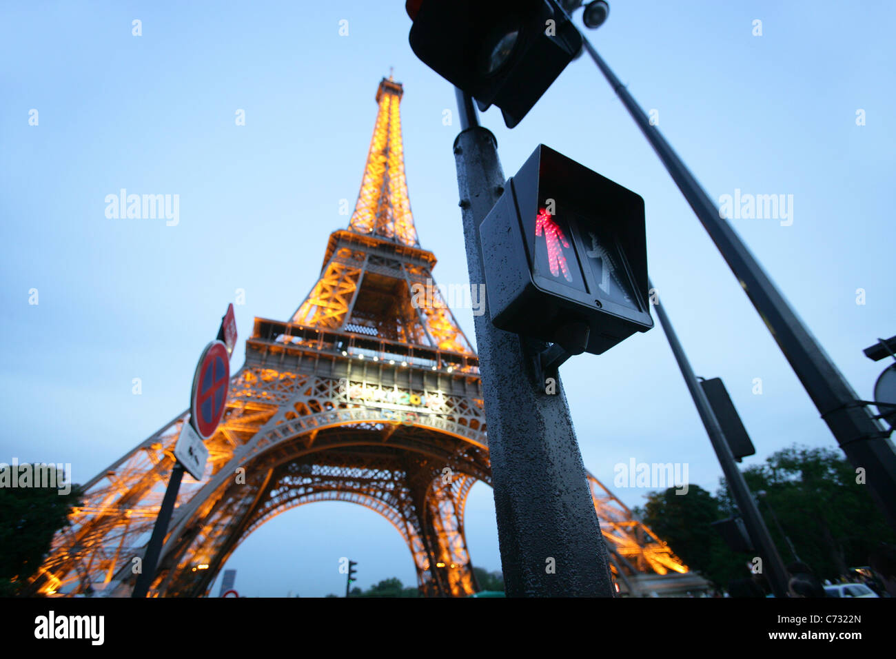 Looking up the Eiffel Tower, red traffic light in the foreground, engineer Gustave Eiffel, 1889, Paris, France Stock Photo