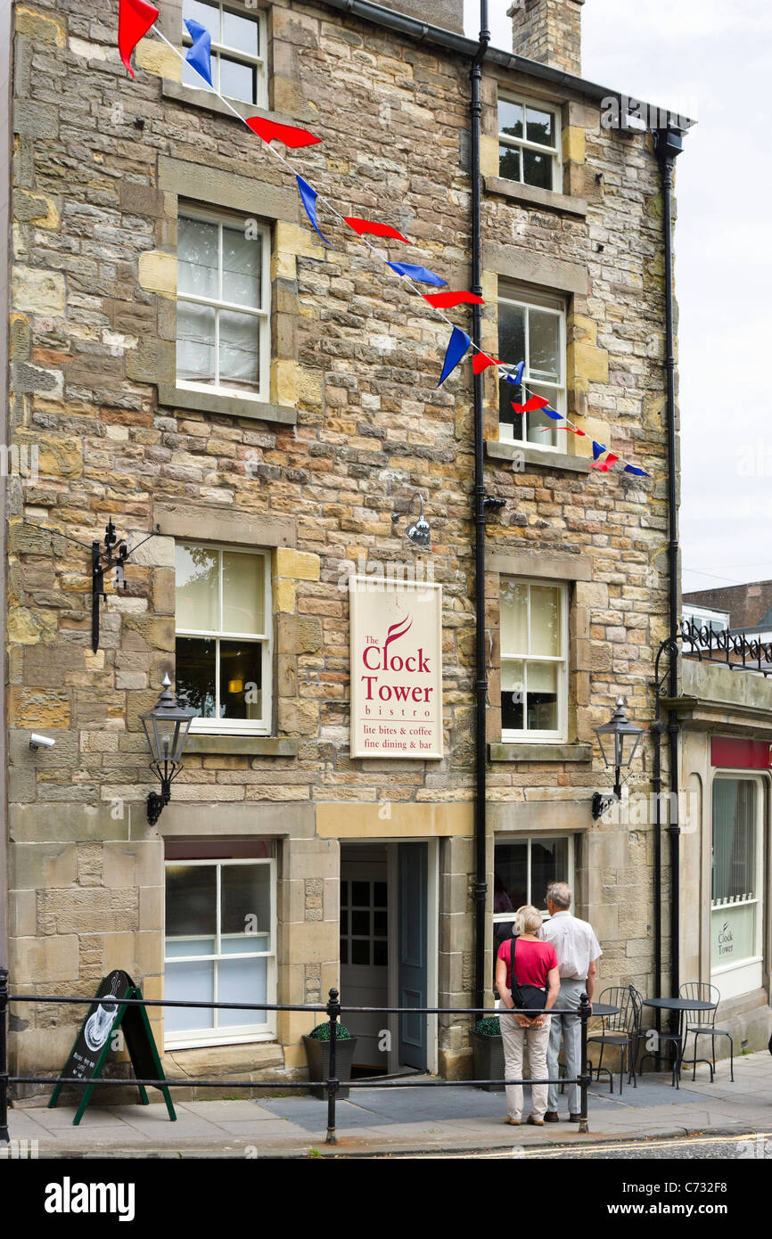 Couple looking at the menu outside a restaurant in the town centre, Jedburgh, Scottish Borders, Scotland, UK Stock Photo