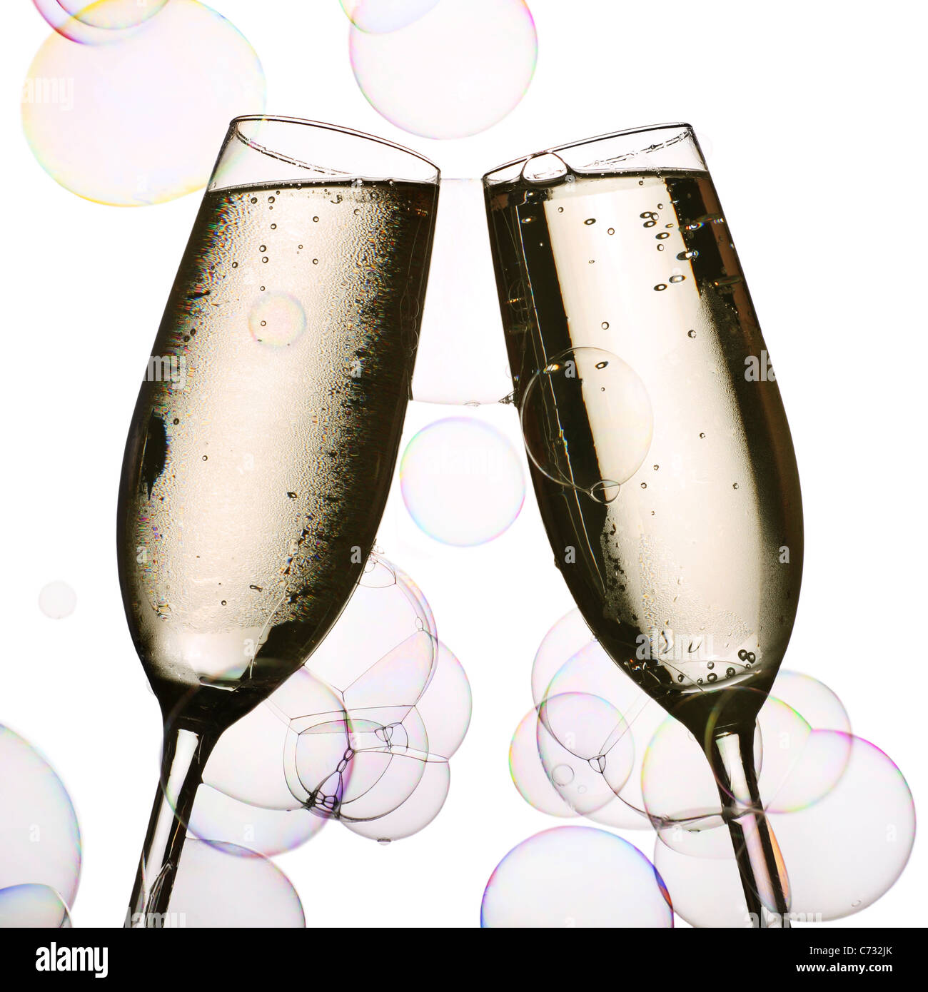 two glasses of chilled champagne and party bubbles Stock Photo
