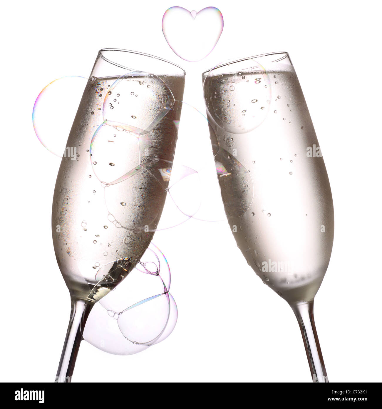 two glasses of chilled champagne with a beautiful heart shaped bubble