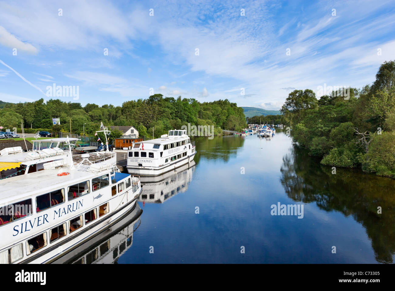 Cruise boats moored on River Leven at the foot of Loch Lomond, Balloch, West Dunbartonshire, Scotland, UK Stock Photo