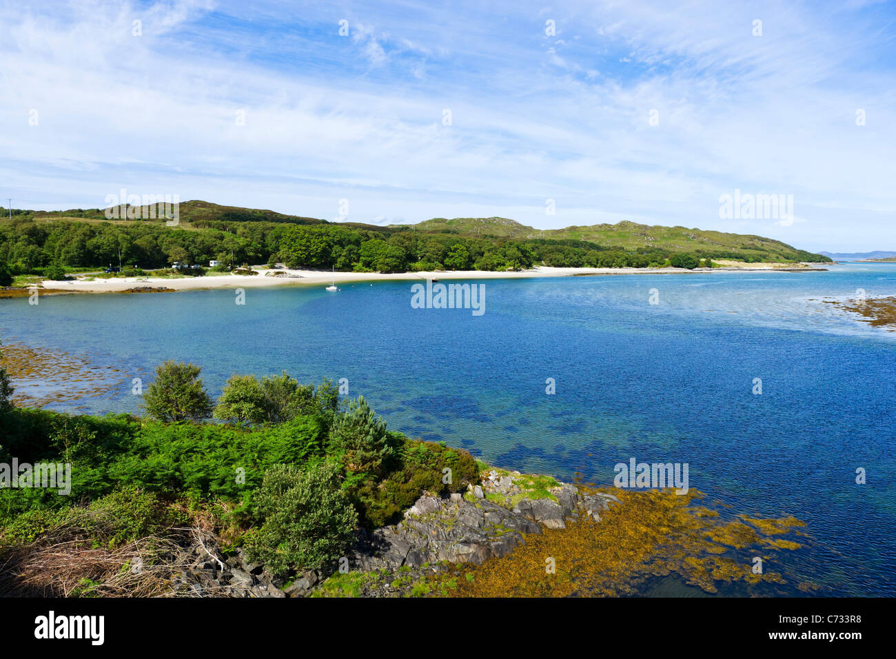 Beach viewed from the bridge over the River Morar on the A830 'Road to the Isles' near to Mallaig, Scottish Highlands, Scotland Stock Photo