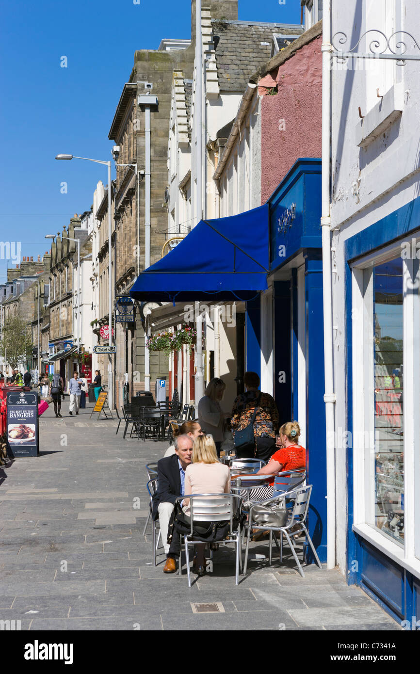 Shops and cafe on Market Street in the old town centre, St Andrews, Fife, Central Scotland, UK Stock Photo