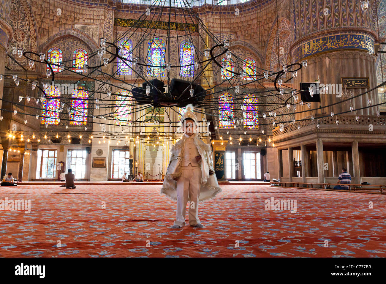 Young Turkish boy in their ceremonial circumcision outfit at The Blue Mosque in Turkey Stock Photo