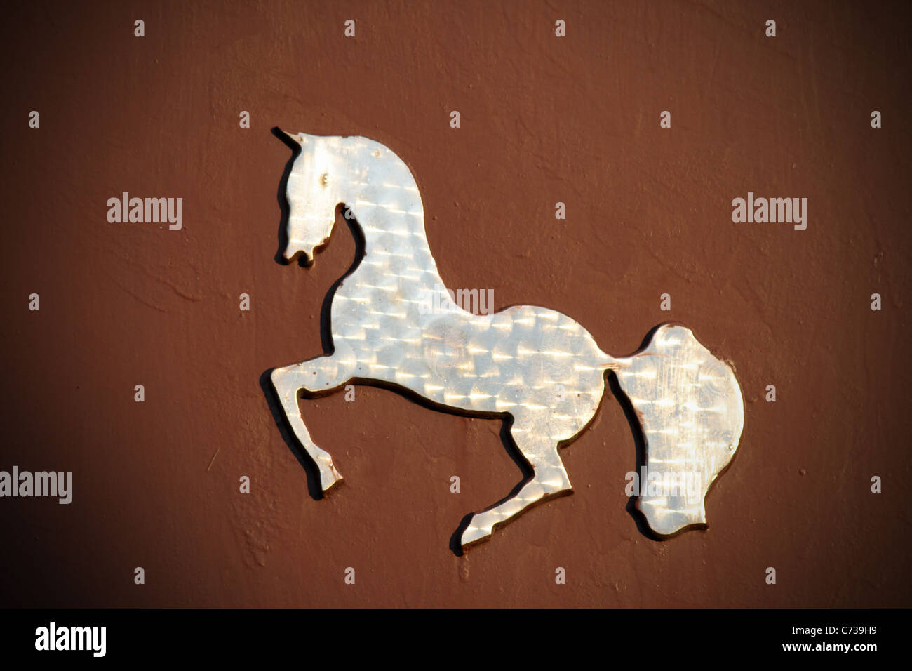 silhouette of a horse carved out of stainless steel, used as decoration door Stock Photo