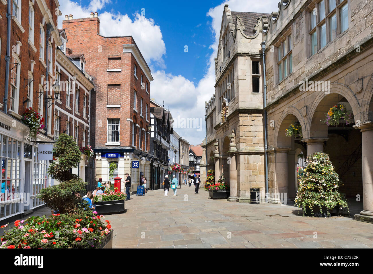 Shops and the Old Market Hall in The Square, Shrewsbury, Shropshire, England, UK Stock Photo
