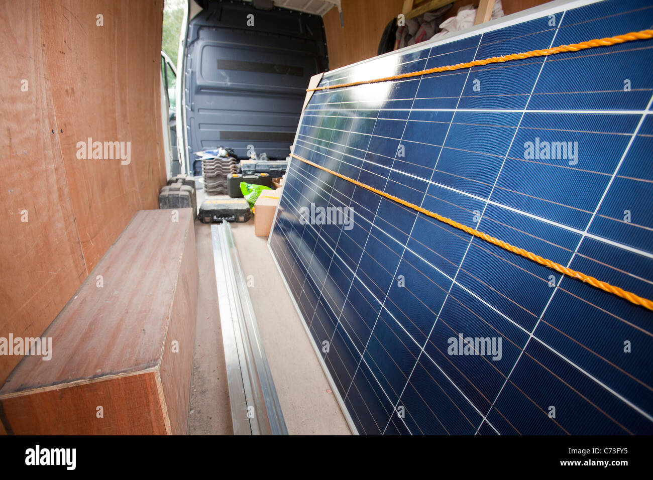 A soalr panels companies van with photo voltaic panels in. Stock Photo