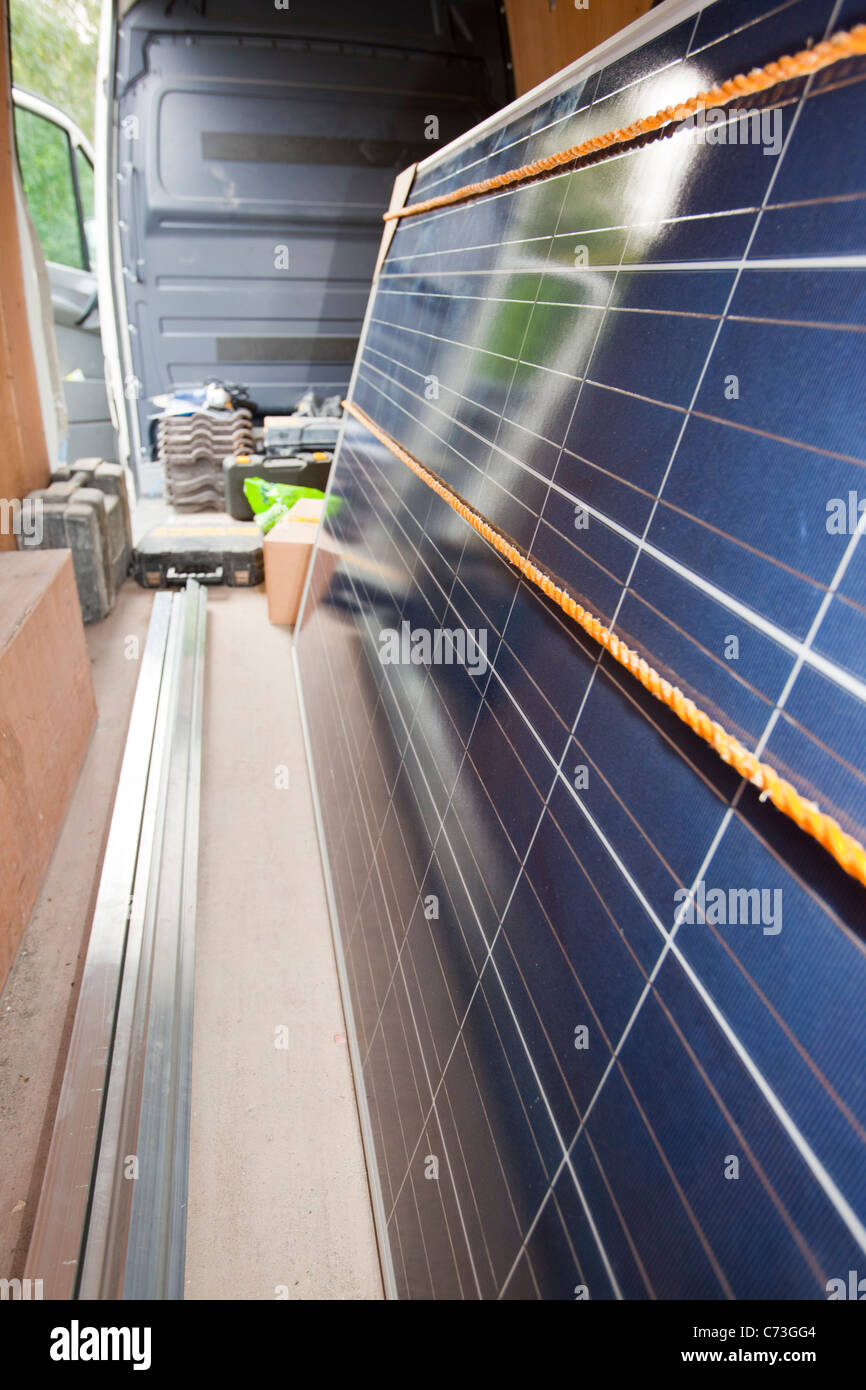 A soalr panels companies van with photo voltaic panels in. Stock Photo