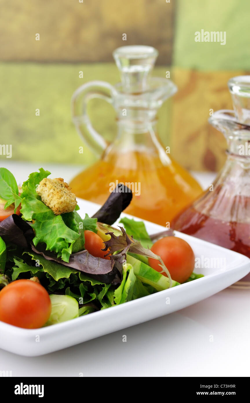 fresh vegetable salad with salad dressings Stock Photo