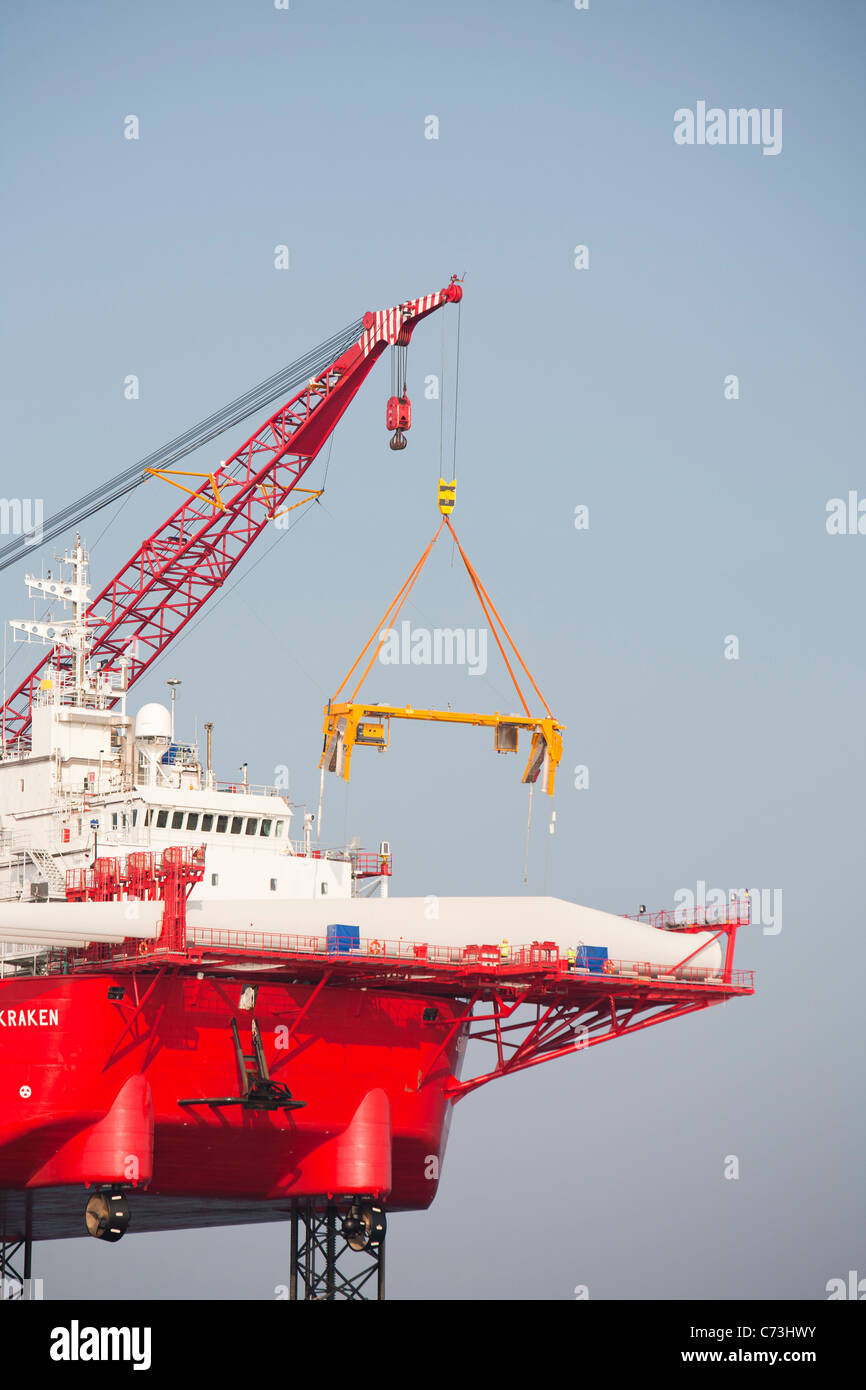 The Jack Up Barge, Krakken, Lifts A Blade Into Place On A Wind Turbine 