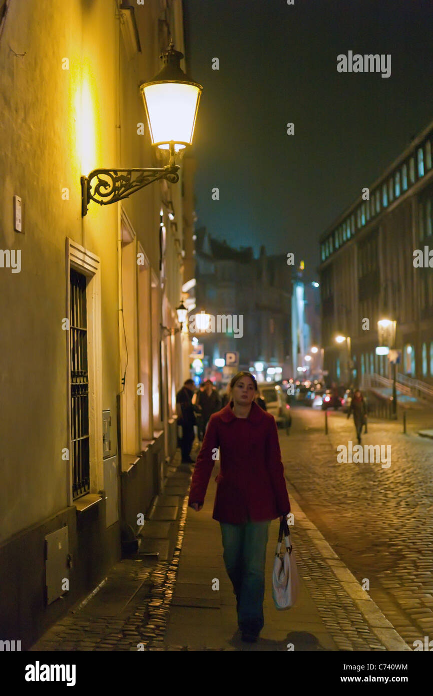 Woman walking street of facades hi-res stock photography and images - Alamy