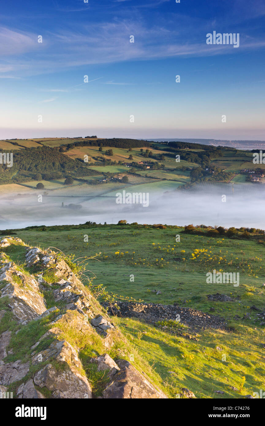 Mist over the Mendips , Mendip Hills Crook Peak towards Weston super Mare , Somerset , England Stock Photo