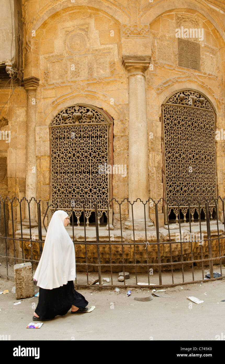 street scene with veiled woman in cairo old town egypt Stock Photo