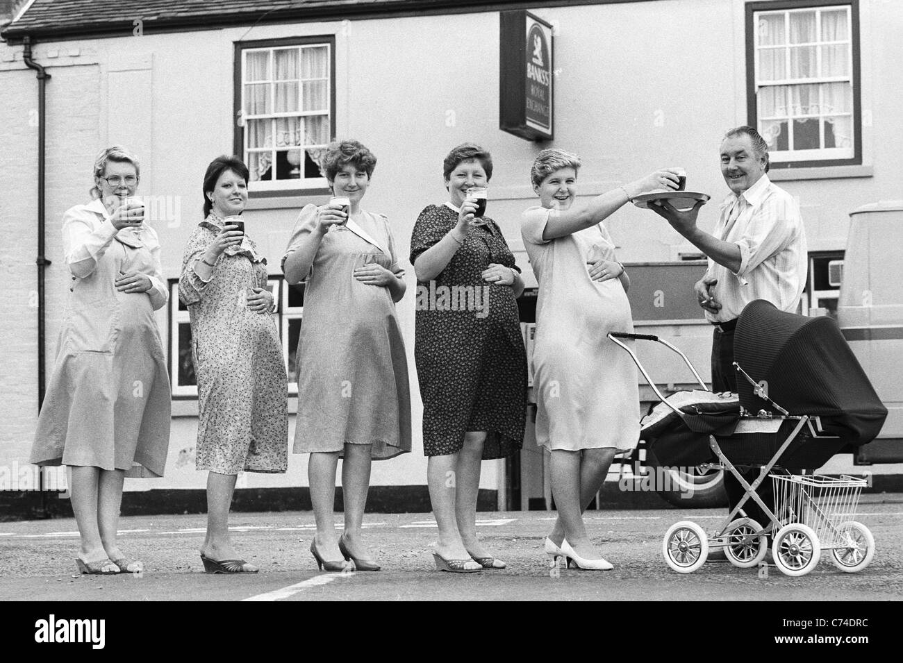 Is it something in the beer! Five pregnant barmaids from the Royal Exchange pub in Bilston 12/9/1984 Picture by DAVID BAGNALL Stock Photo
