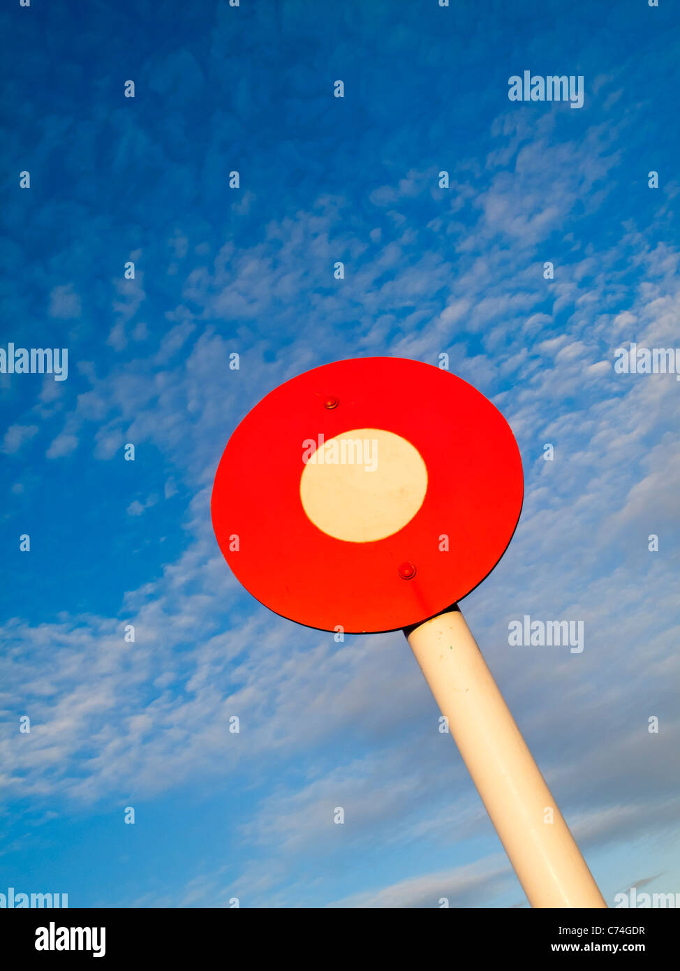 Circular Winning Post sign with blue sky behind Stock Photo