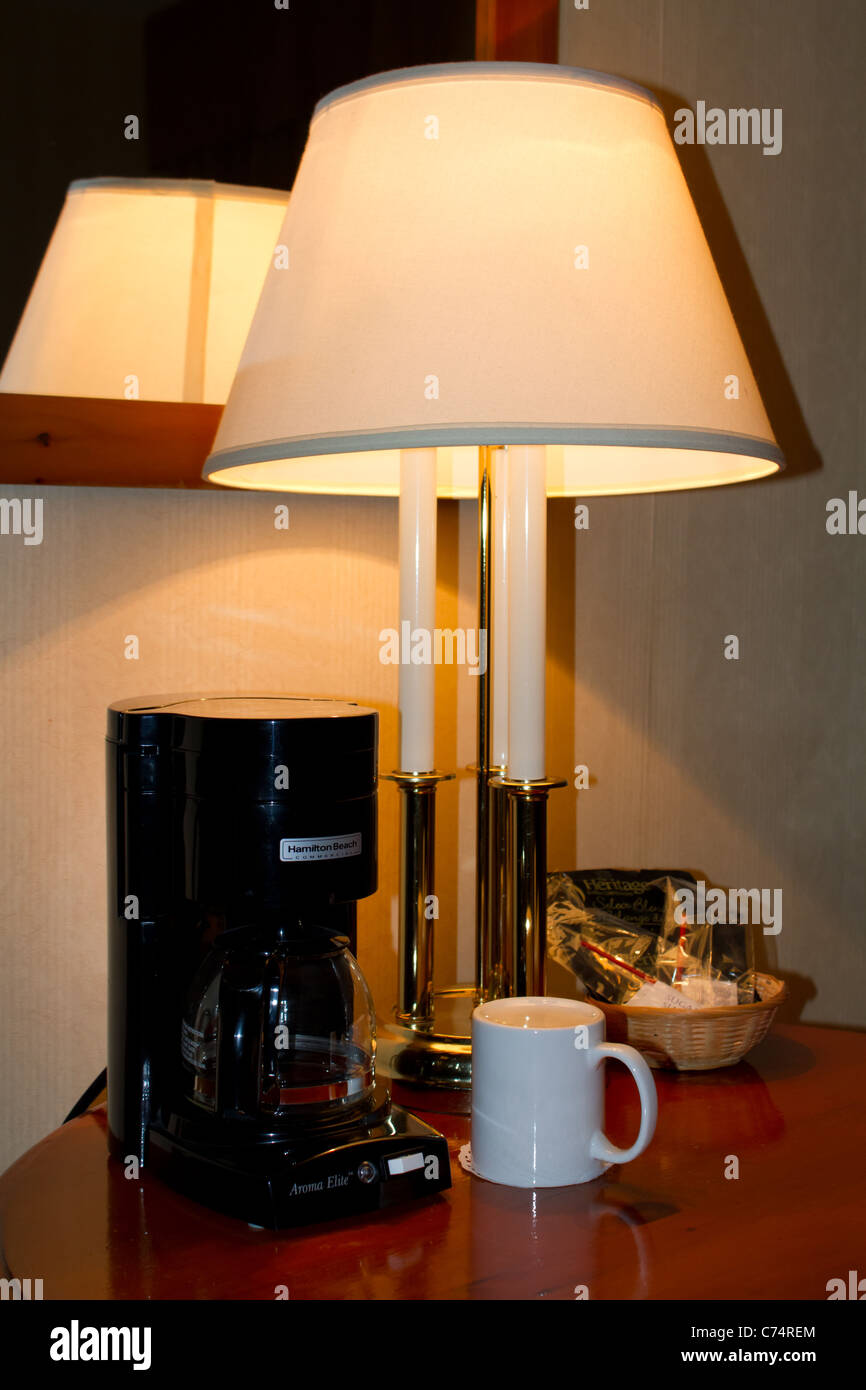 retro table lamp coffee machine mug hotel room Stock Photo