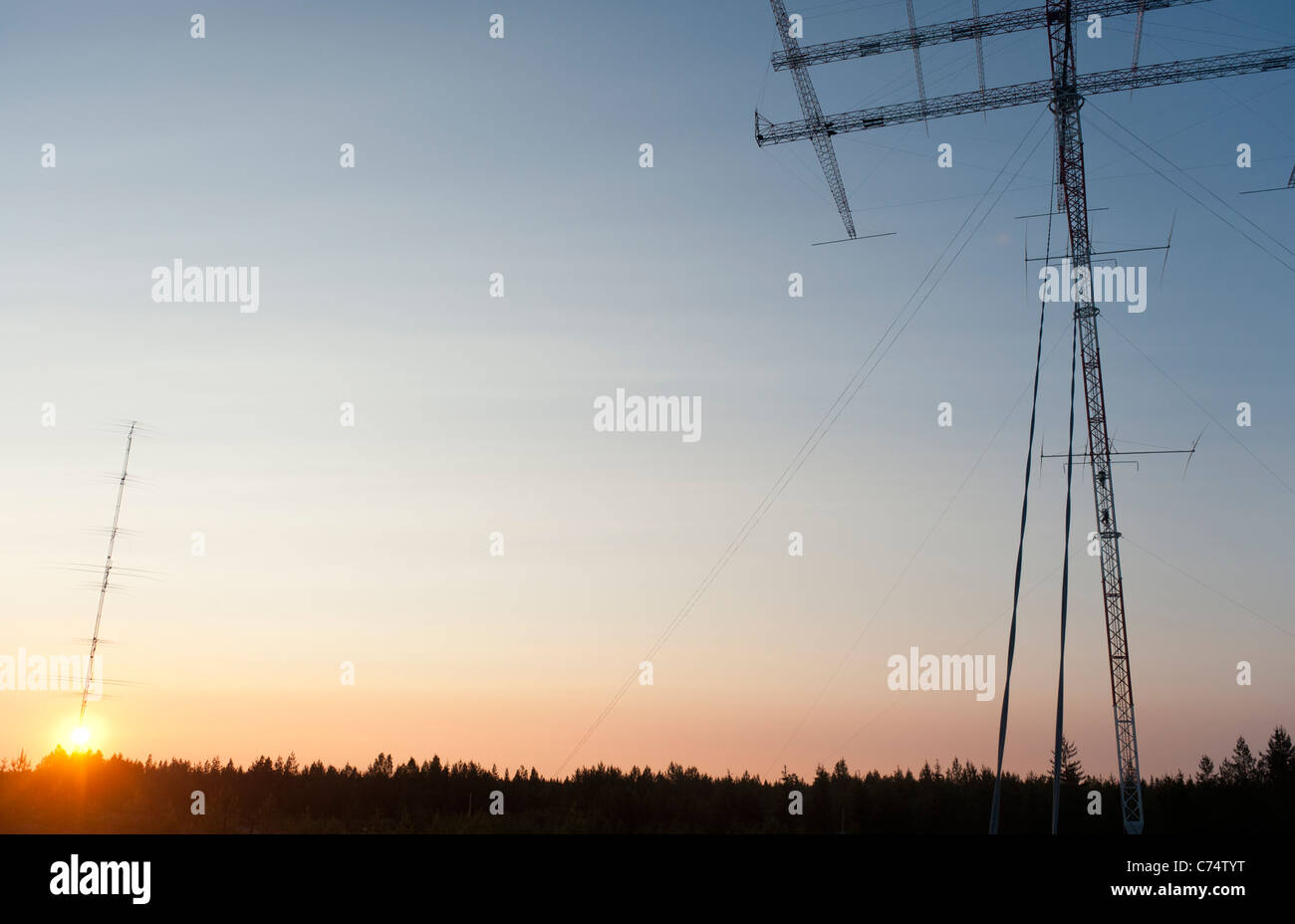 Base jumpers climbing to the rotating radio amateur antenna od Radio