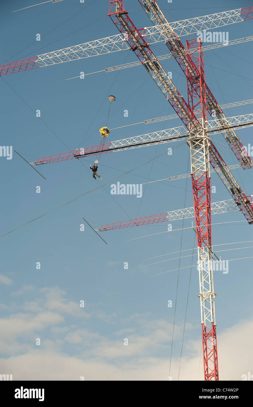 Base jumper taking of from the 100 meters high rotating radio amateur  antenna of Radio Arcala, near Oulu, Finland Stock Photo - Alamy