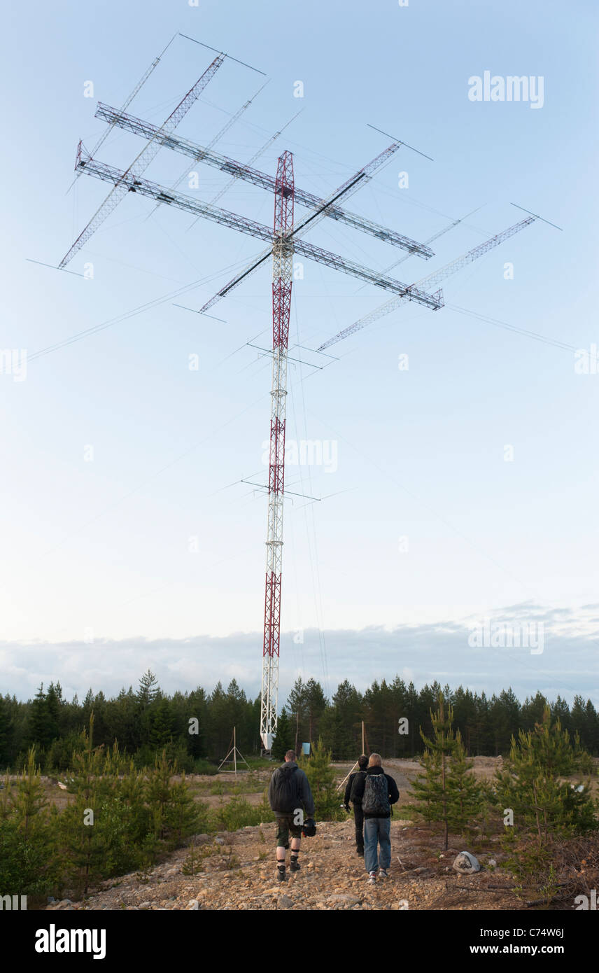 Base jumpers walking towards their object, the rotating radio amateur  antenna of Radio Arcala near Oulu, Finland Stock Photo - Alamy