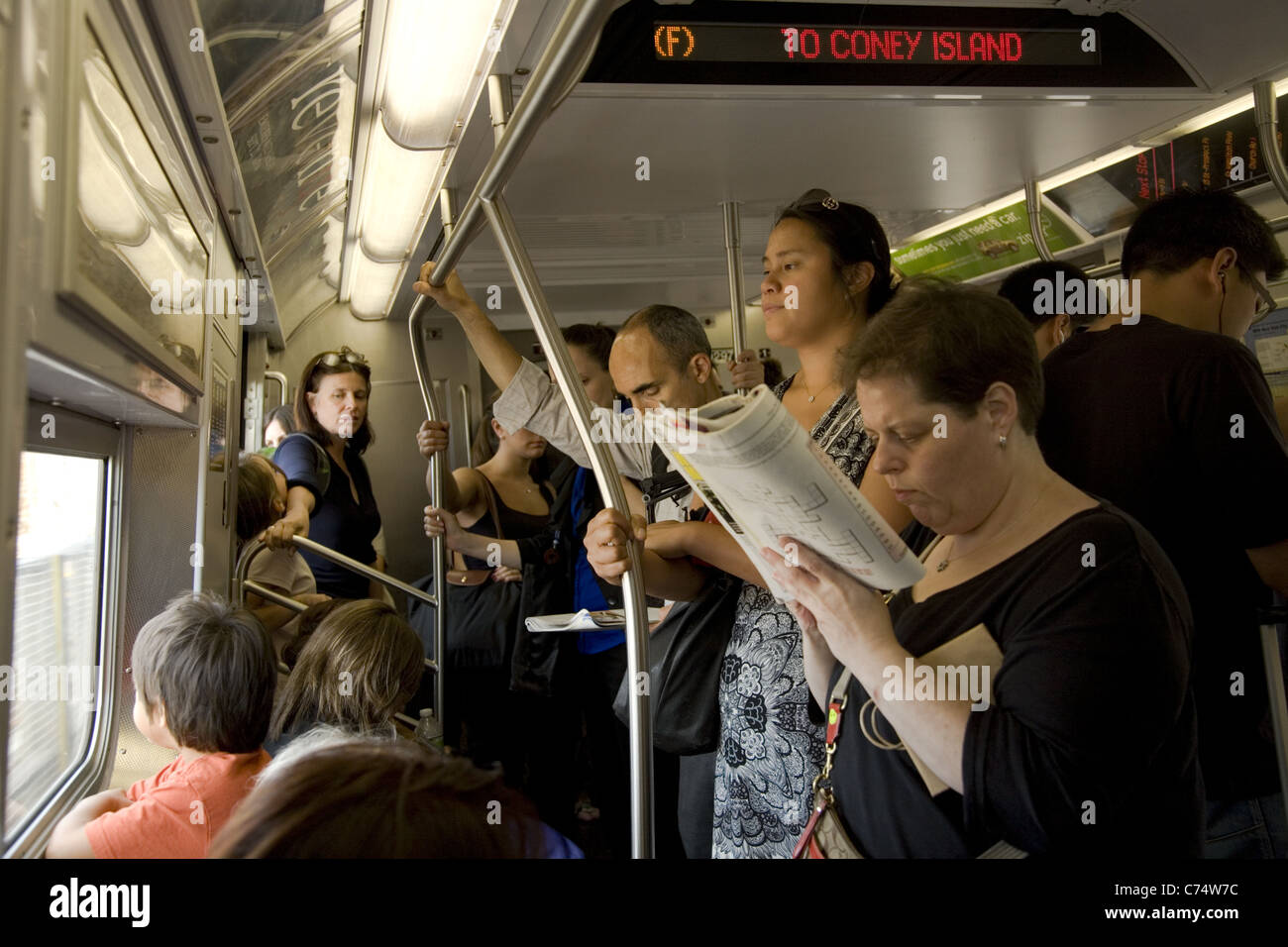 Crowded subway car, F Train, Brooklyn, NYC. Stock Photo