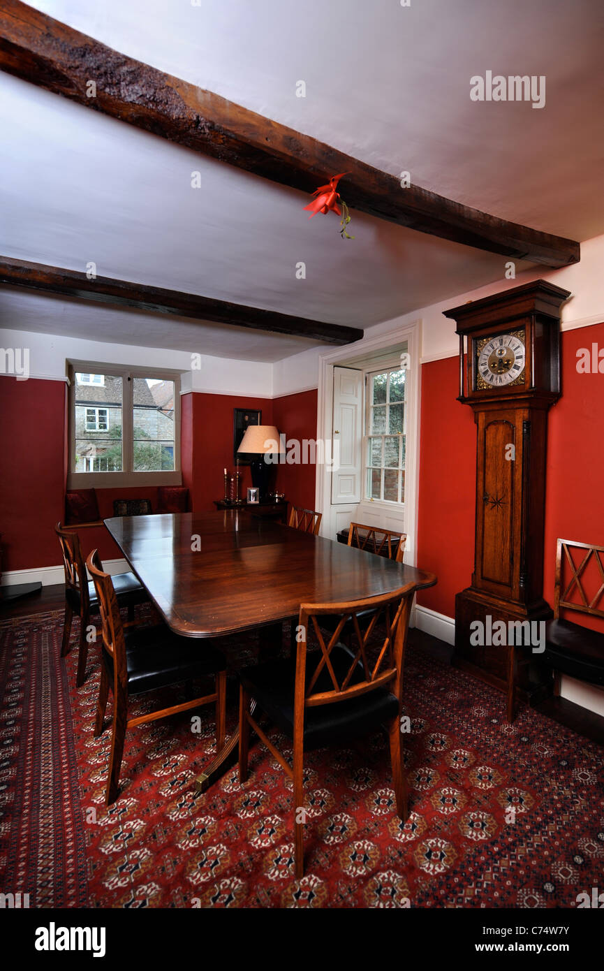 Traditional English country dining room with a grandfather clock UK Stock Photo