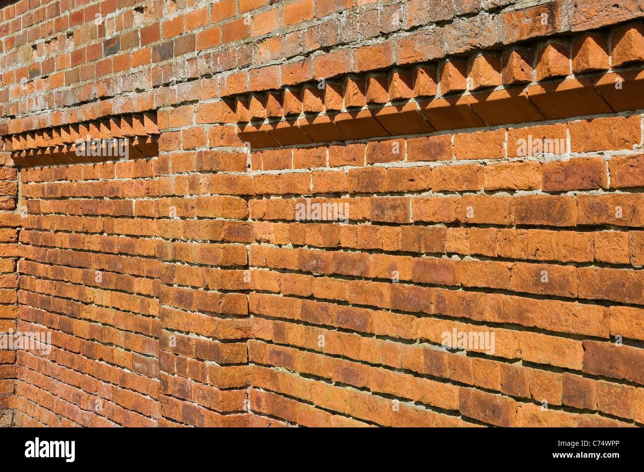 Close up of traditional red brick bricks wall building England UK United Kingdom GB Great Britain Stock Photo