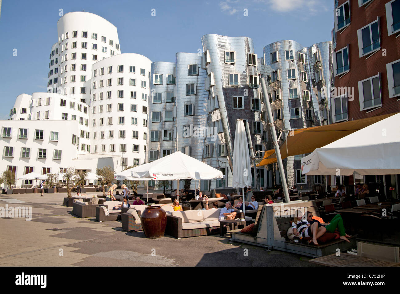 Restaurant at The Neue Zollhof  designed by  architect Frank O. Gehry of Media Harbor in  Duesseldorf,  Germany Stock Photo