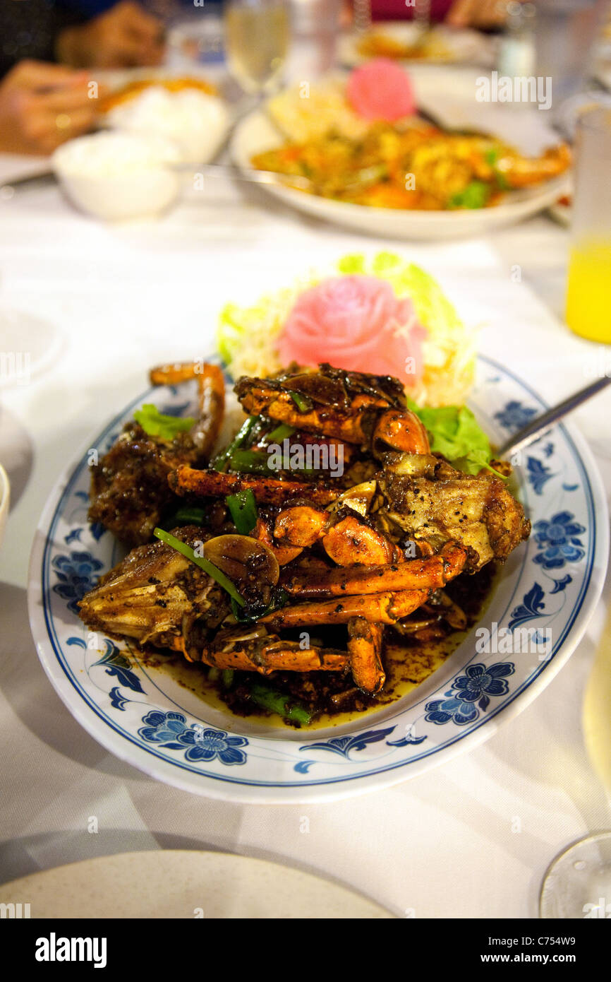 Black Peppercorn Crab dish in a restaurant at Boat Quay, Singapore asia Stock Photo