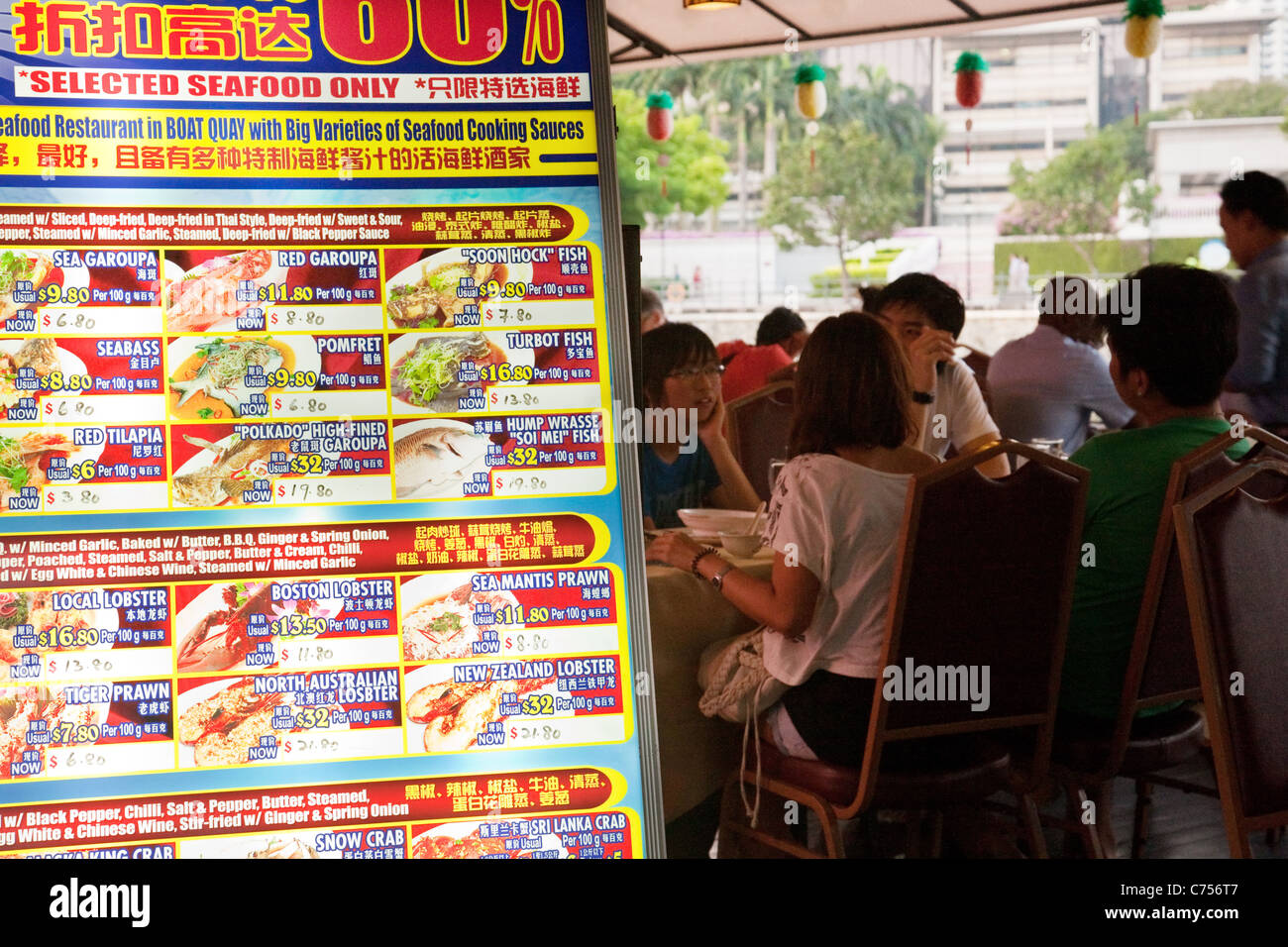 People eating at a seafood restaurant, Boat Quay, Singapore asia Stock