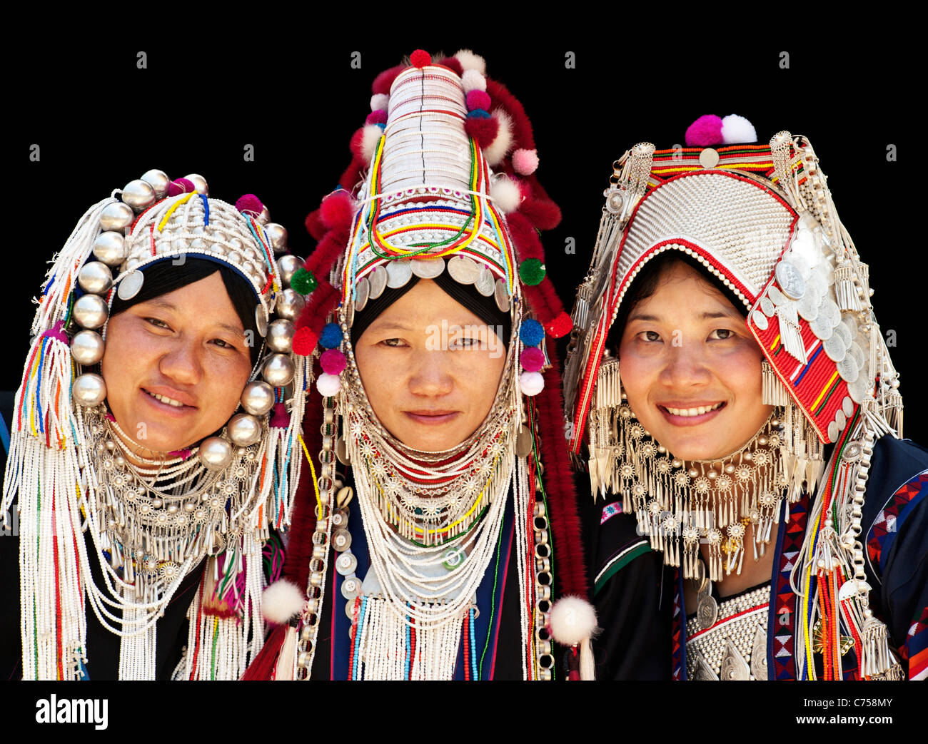 Three women wearing the different Akha head dresses in Chiang Rai ...