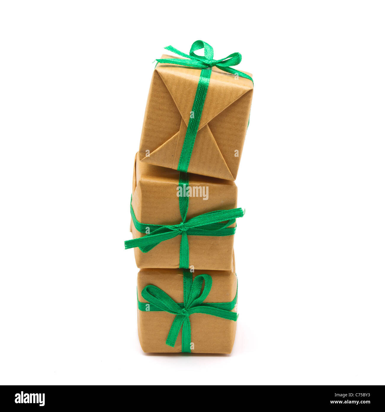 Pile of Gift boxes wrapped in brown paper isolated on white. Stock Photo
