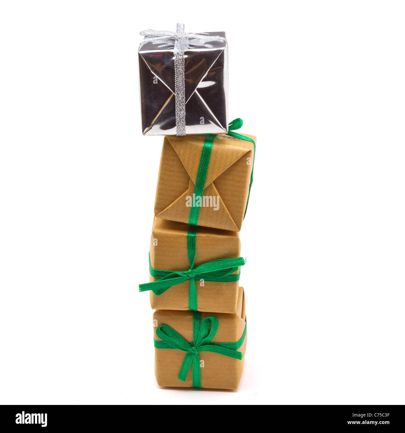 Pile of Gift boxes wrapped in brown paper isolated on white. Stock Photo