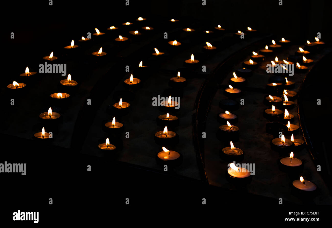 Lighted candles in church Stock Photo Alamy