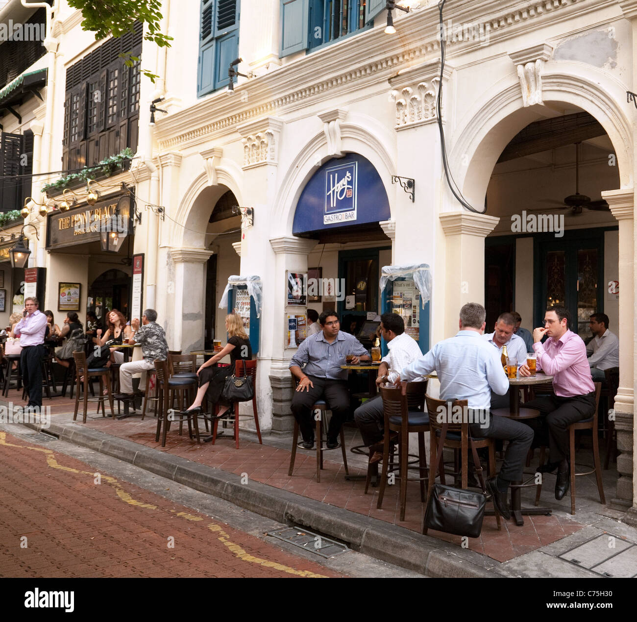 People drinking at Harry's Bar, Boat Quay Singapore Asia Stock Photo