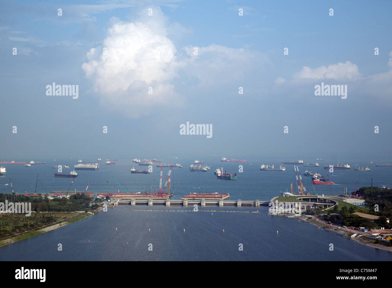 A view from the Singapore Flyer towards the marina barrage and the ships waiting to come into harbour, Singapore Asia Stock Photo