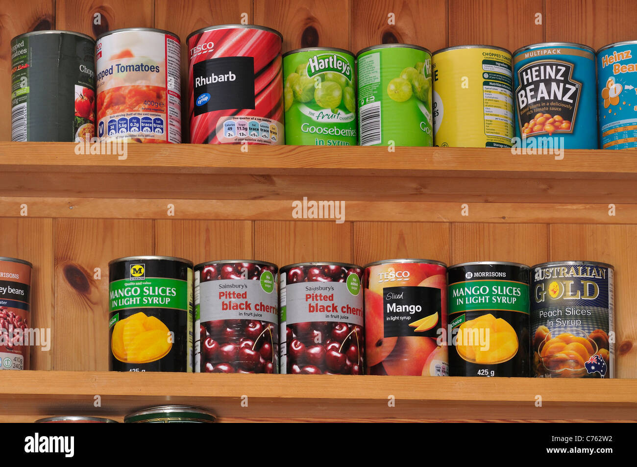 Tins of food on shelves in a kitchen UK Stock Photo Alamy