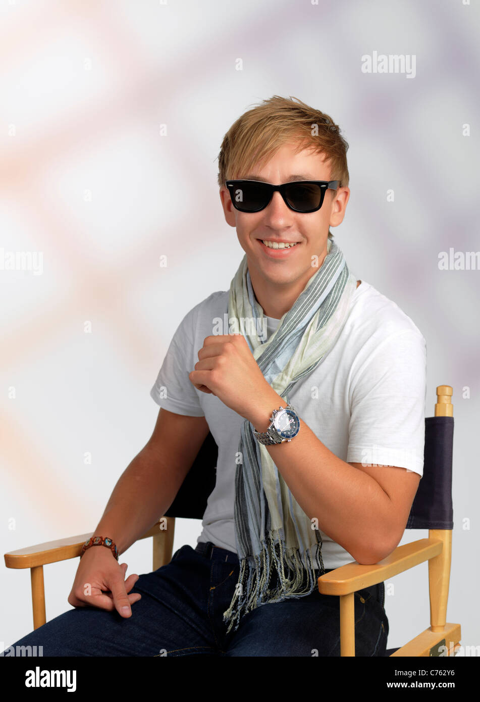 Handsome young man posing as a film director Stock Photo