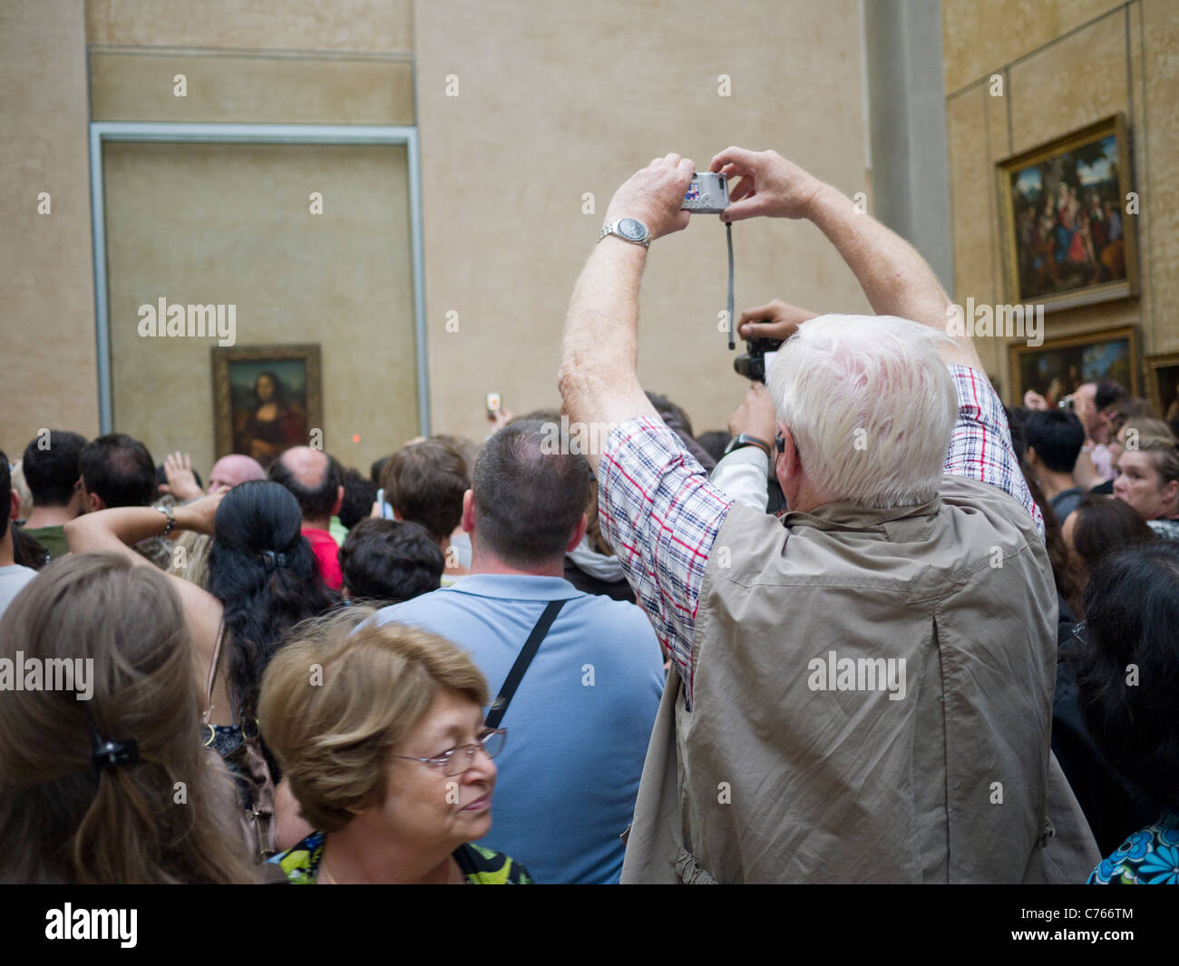 The Louvre Museum, Paris France, crowds looking at the Mona Lisa painting Stock Photo