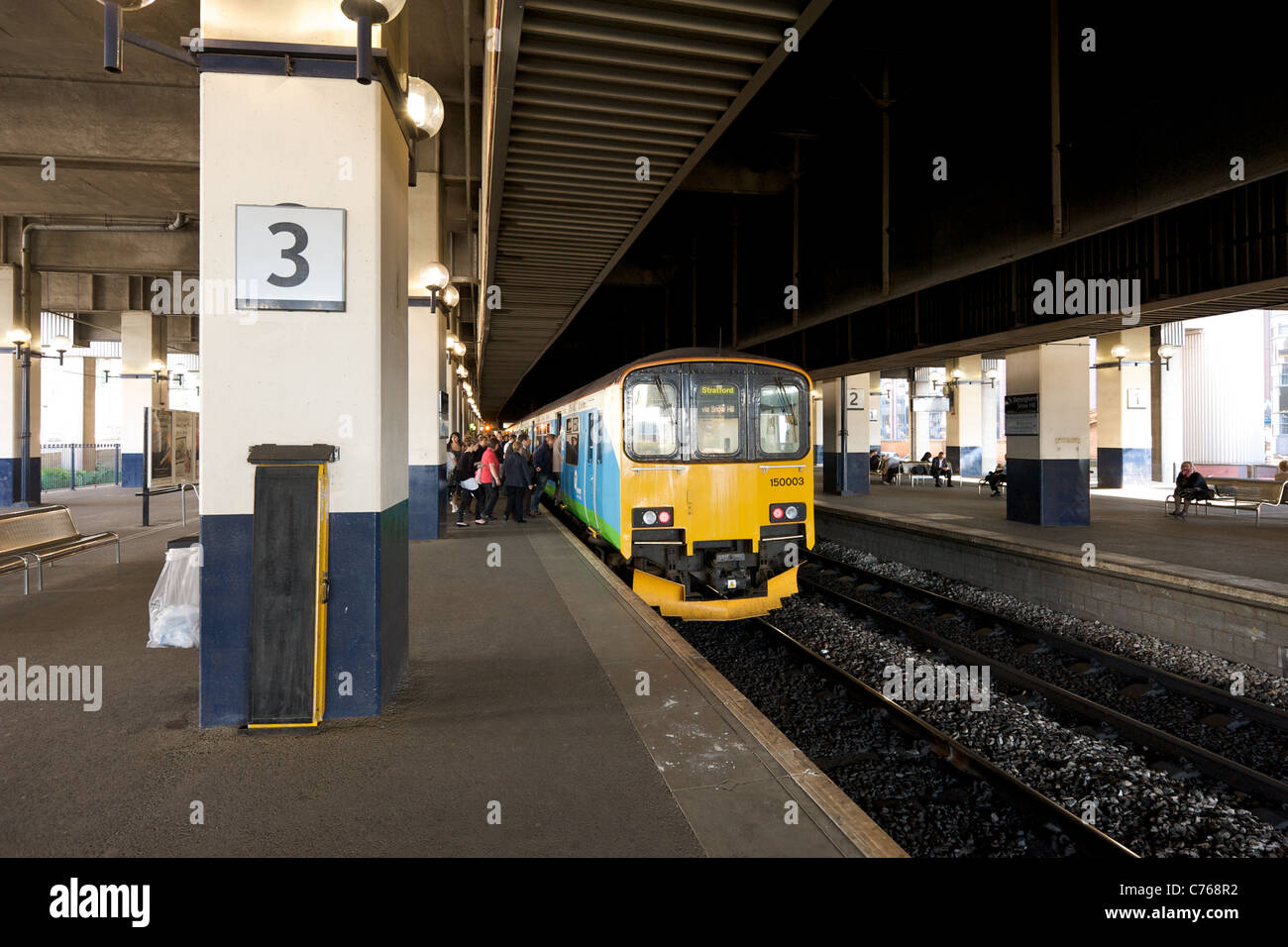 Passengers boarding the train in Birmingham Snow Hill railway station, England, UK Stock Photo
