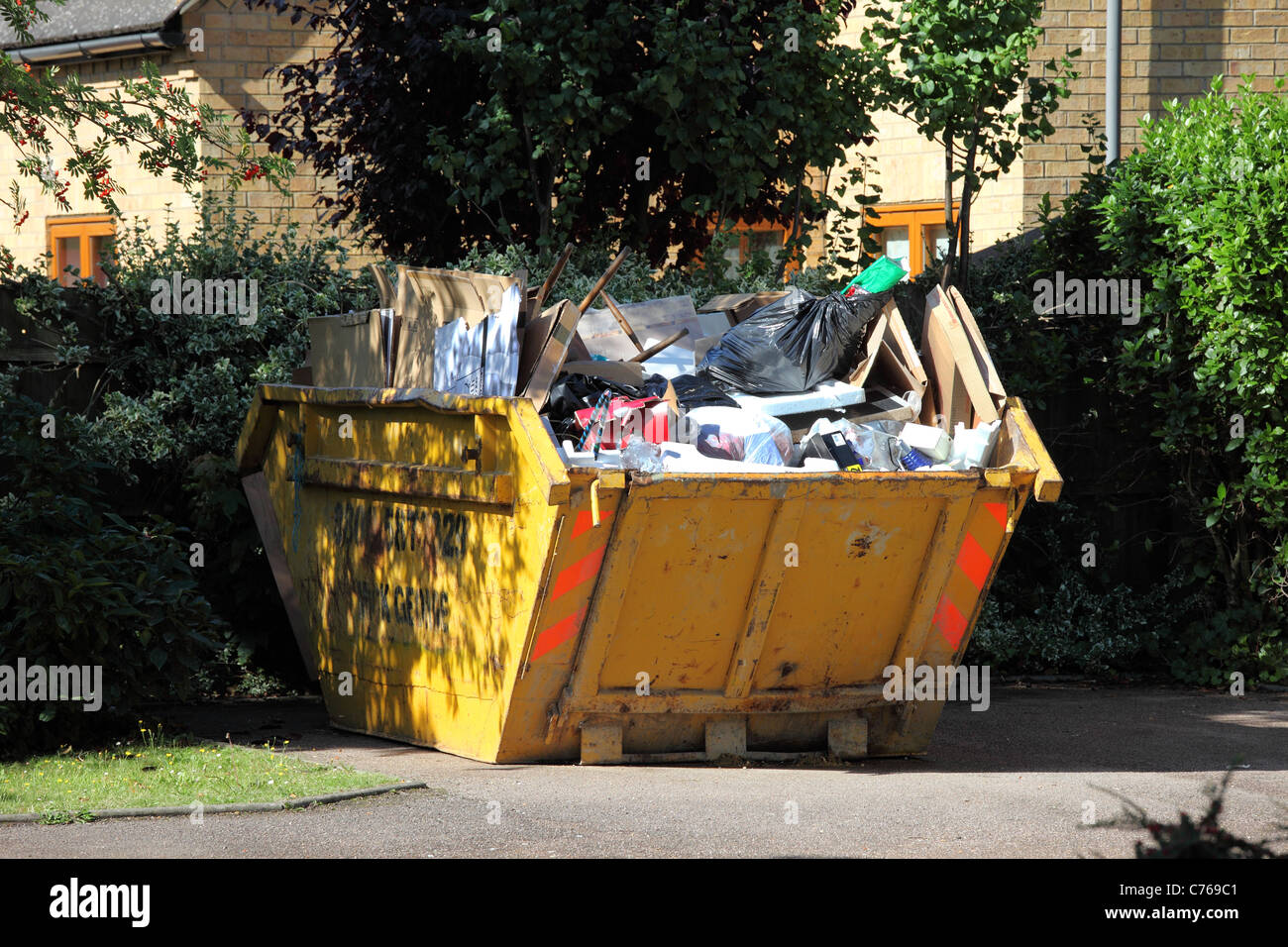 Full Rubbish skip Stock Photo Alamy