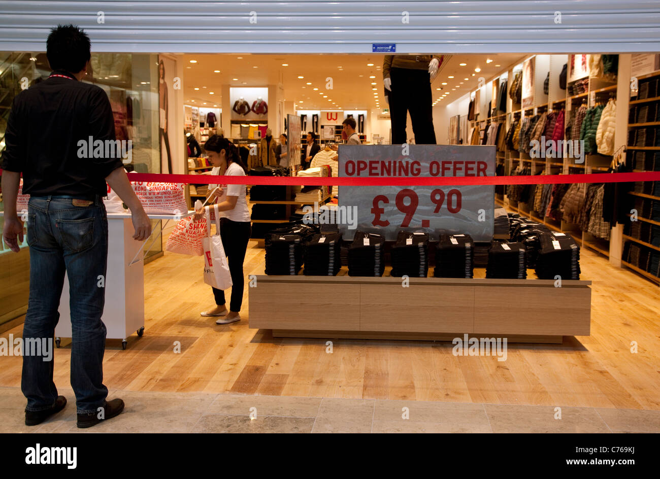 Westfield Stratford City shopping centre, London - store with red ribbon on opening day Stock Photo