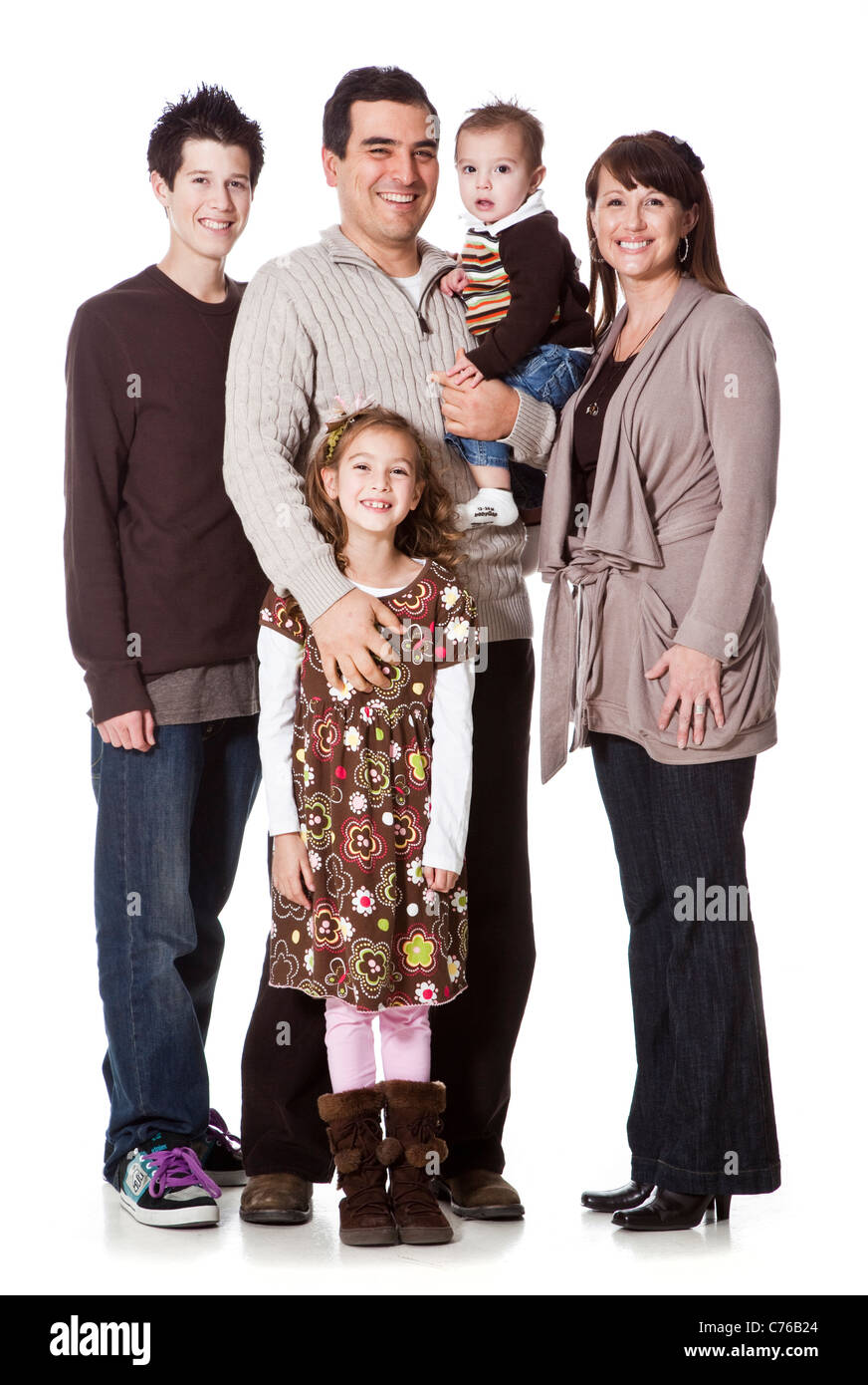 Portrait of family with three children (16-17, 8-9, 2-3), studio shot Stock Photo