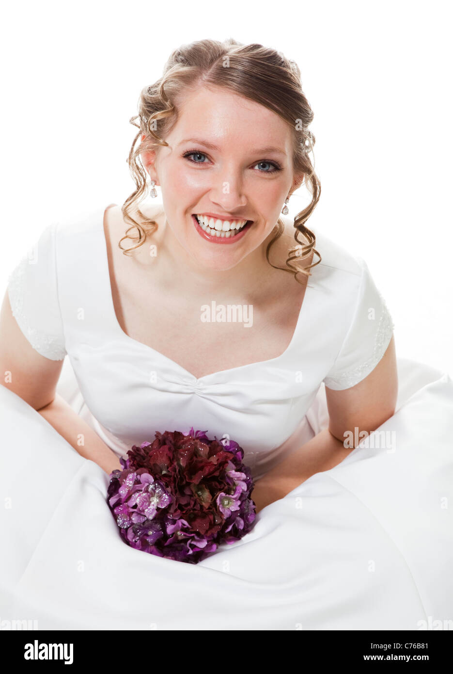 Portrait of happy bride holding bouquet, studio shot Stock Photo - Alamy