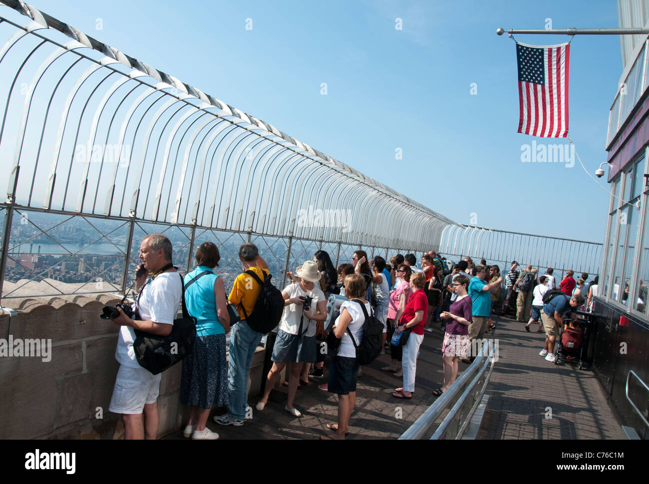people-at-the-top-of-the-empire-state-building-in-new-york-usa-stock