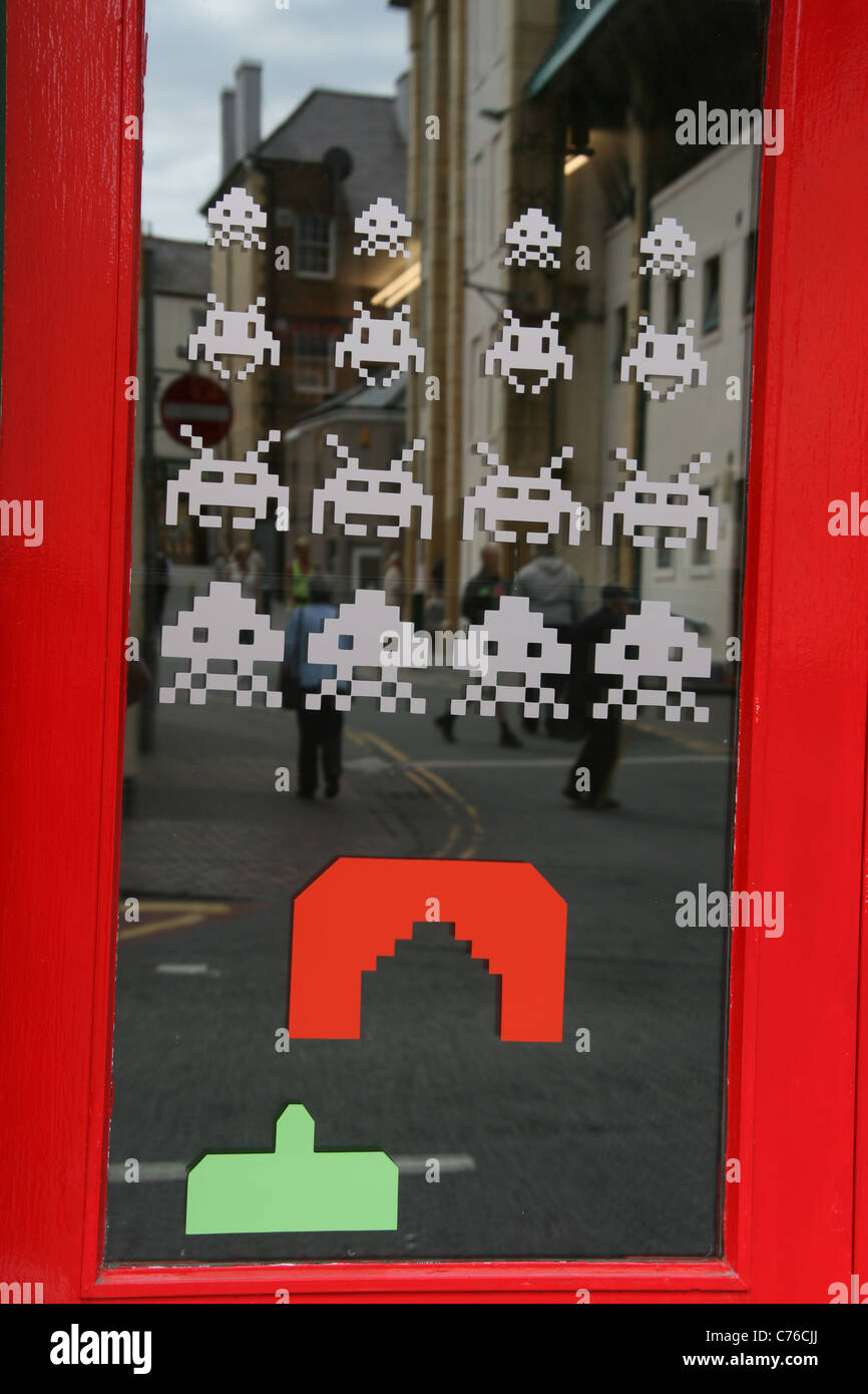 space invaders game image on computer games shop window in wales great britain uk Stock Photo
