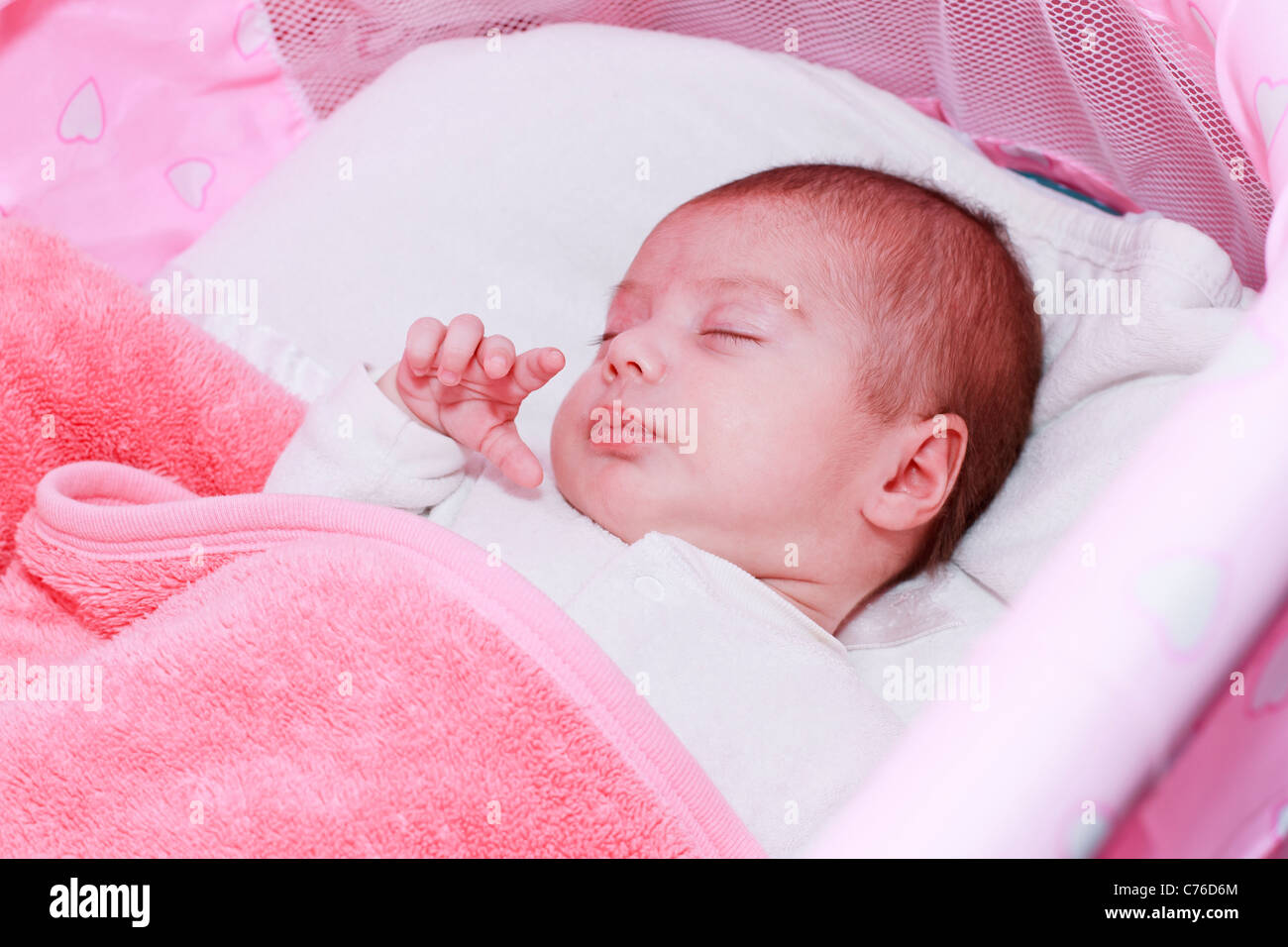 Baby sleeping in his crib Stock Photo