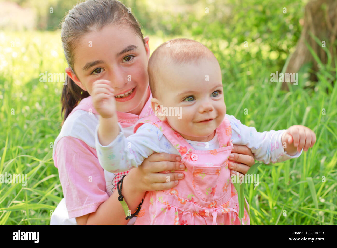 help to walking a baby girl Stock Photo